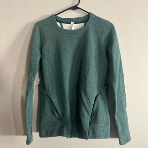 Size 6 long-sleeve Lululemon crewneck with back cutouts.